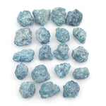 blue natural raw diamond pieces arranged as a loose uncut rough diamond lot