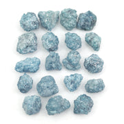 blue natural raw diamond pieces arranged as a loose uncut rough diamond lot