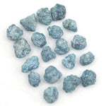 blue natural raw diamond pieces arranged as a loose uncut rough diamond lot