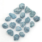 blue natural raw diamond pieces arranged as a loose uncut rough diamond lot