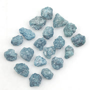 blue natural raw diamond pieces arranged as a loose uncut rough diamond lot