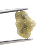 rough yellow diamond with an uncut natural appearance for a bespoke gold brooch jewelry design.