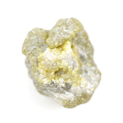 natural yellow uncut diamond with a rugged surface, suitable for designing a distinctive custom ring.
