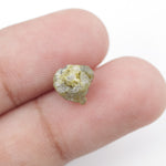 natural yellow uncut diamond with a rugged surface, suitable for designing a distinctive custom ring.