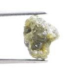 unpolished yellow natural diamond with a rough exterior, selected for creating distinctive gold fine jewelry pieces.