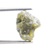 unpolished yellow natural diamond with a rough exterior, selected for creating distinctive gold fine jewelry pieces.