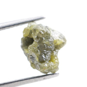 unpolished yellow natural diamond with a rough exterior, selected for creating distinctive gold fine jewelry pieces.