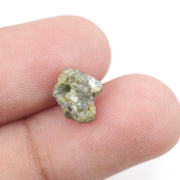 unpolished yellow natural diamond with a rough exterior, selected for creating distinctive gold fine jewelry pieces.