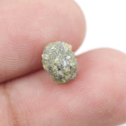 natural yellow diamond in an uncut, irregular form for creating bespoke gold jewelry with a distinctive raw appearance.