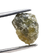 uncut yellow natural diamond with a rugged, irregular surface for designing personalized gold jewelry pieces.