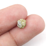 raw yellow natural diamond with an uncut surface, suitable for designing personalized promise rings and meaningful jewelry pieces.