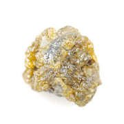 uncut yellow natural diamond with a raw, irregular surface for creating a distinctive anniversary ring or personalized jewelry design.