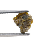 uncut yellow natural diamond with a raw, irregular surface for creating a distinctive anniversary ring or personalized jewelry design.