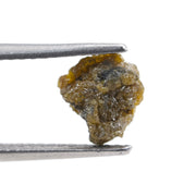 uncut yellow natural diamond with a raw, irregular surface for creating a distinctive anniversary ring or personalized jewelry design.