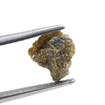 uncut yellow natural diamond with a raw, irregular surface for creating a distinctive anniversary ring or personalized jewelry design.