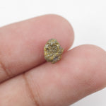 uncut yellow natural diamond with a raw, irregular surface for creating a distinctive anniversary ring or personalized jewelry design.