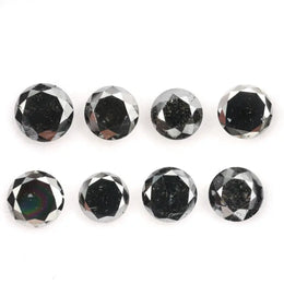 Lot of natural salt and pepper round cut diamonds with dark grey and black inclusions, genuine rustic galaxy diamonds for custom jewelry making, loose natural diamonds arranged on white background.