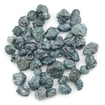 blue natural rough diamond with an irregular raw surface for jewelry making