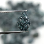 blue natural rough diamond with an irregular raw surface for jewelry making