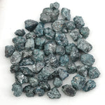 natural blue rough diamond with a raw uncut surface for jewelry designers