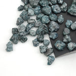 natural blue rough diamond with a raw uncut surface for jewelry designers