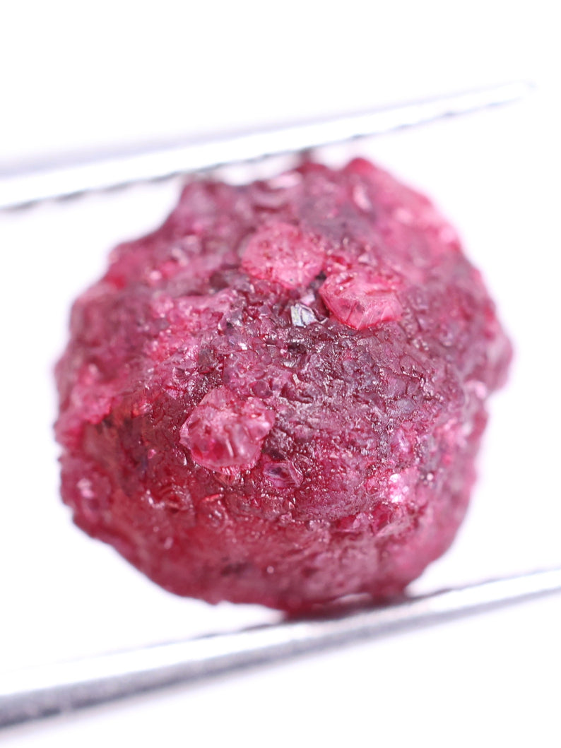 Pink rough diamond  ball on a white background