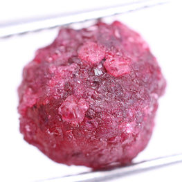 Pink rough diamond  ball on a white background