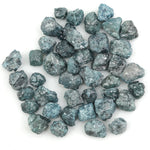 blue natural rough diamond with an uncut raw surface for custom jewelry designs