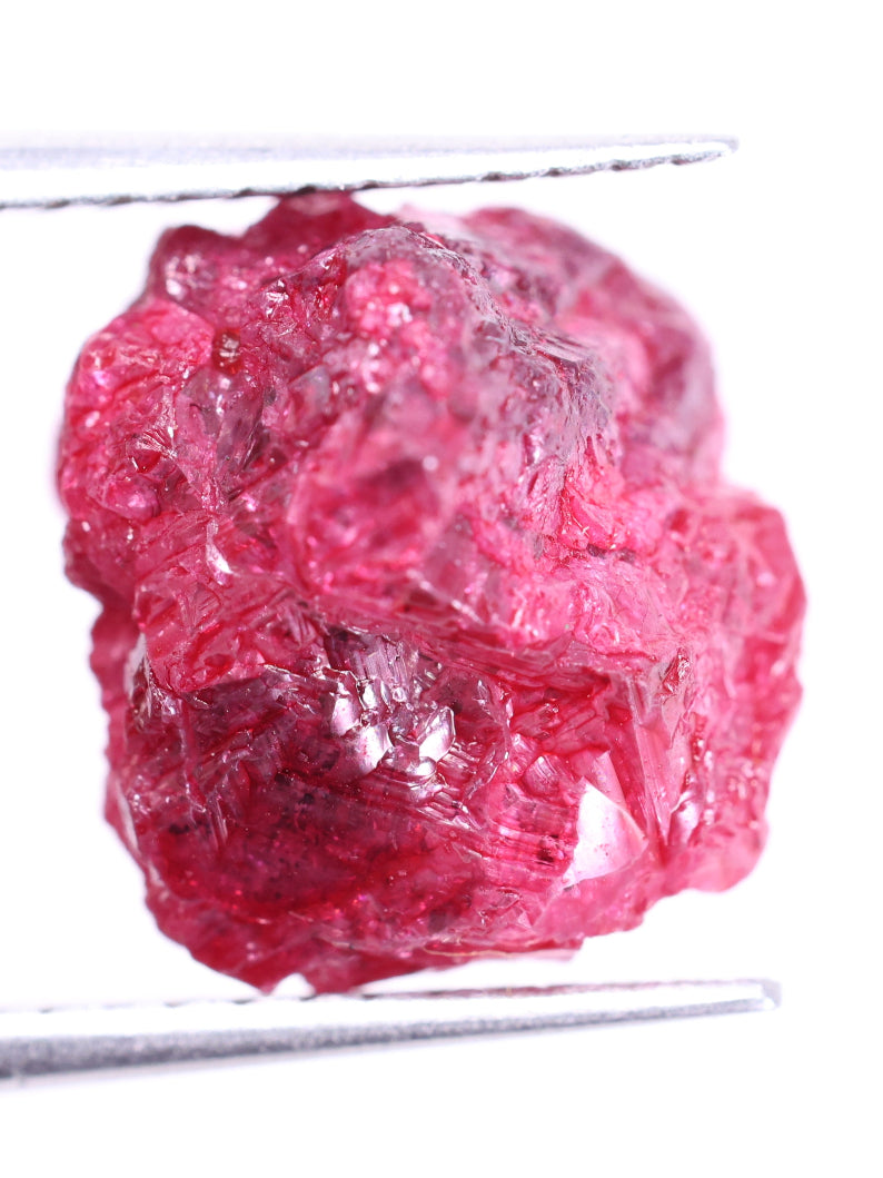 Raw pink diamond on a white background