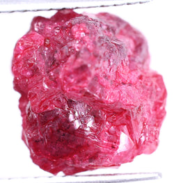 Raw pink diamond on a white background