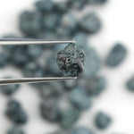 blue natural rough diamond with an uncut raw surface for custom jewelry designs