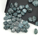blue natural rough diamond with an uncut raw surface for custom jewelry designs