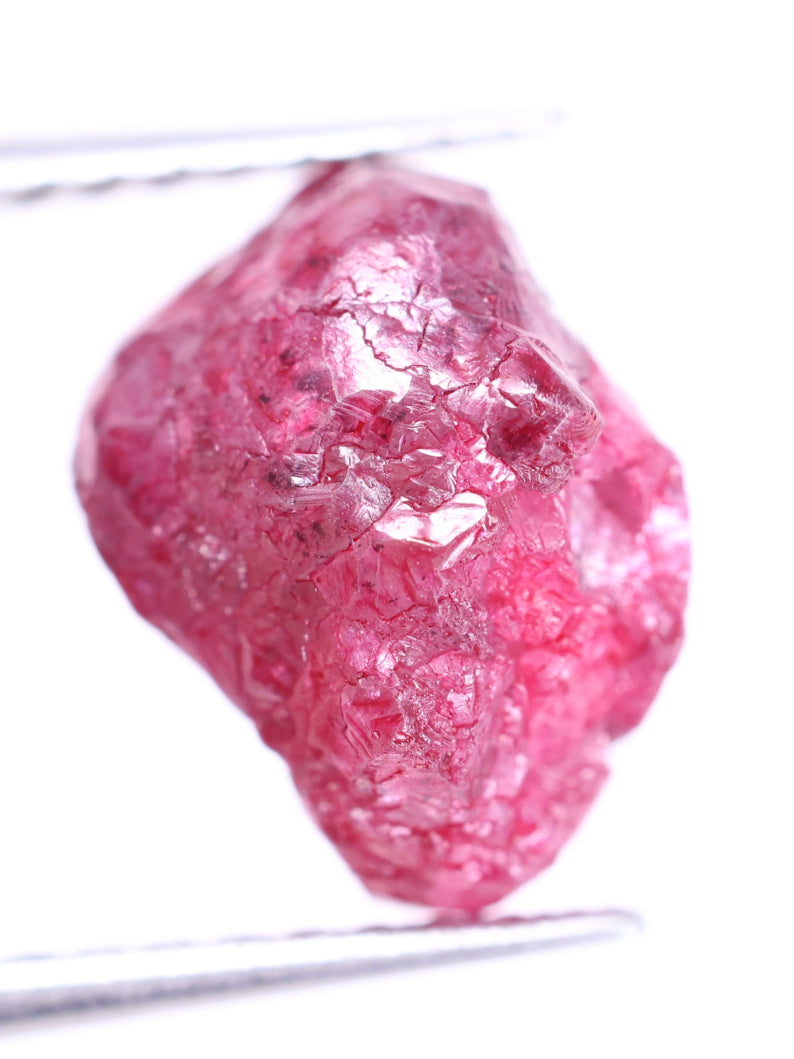 Pink rough diamond on a white background