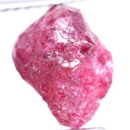 Pink rough diamond on a white background