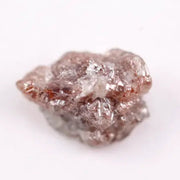 a raw diamond showing cost of raw diamond and how to identify a raw diamond at home with loose raw diamonds and a natural raw diamond ring display