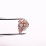 a raw diamond showing cost of raw diamond and how to identify a raw diamond at home with loose raw diamonds and a natural raw diamond ring display