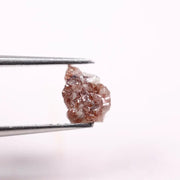 a raw diamond showing cost of raw diamond and how to identify a raw diamond at home with loose raw diamonds and a natural raw diamond ring display