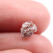 a raw diamond showing cost of raw diamond and how to identify a raw diamond at home with loose raw diamonds and a natural raw diamond ring display
