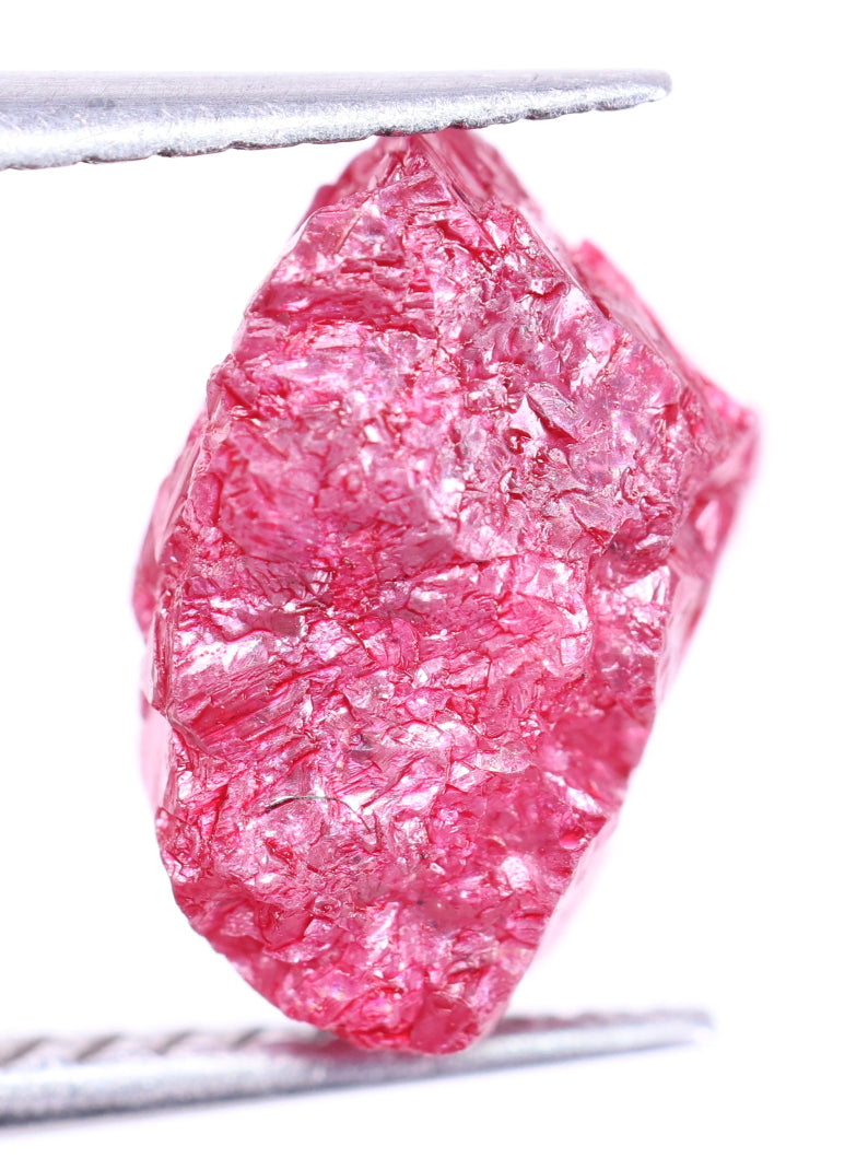 Pink rough diamond on a white background
