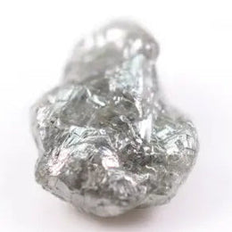 unpolished diamond showing what does a diamond in the rough look like and what does a real diamond look like with natural cut diamond and natural diamond chain details
