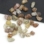 mixed color natural rough diamond pieces with uncut raw surfaces for custom jewelry