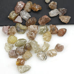mixed color natural rough diamond pieces with uncut raw surfaces for custom jewelry