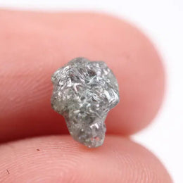 unpolished diamond showing what does a diamond in the rough look like and what does a real diamond look like with natural cut diamond and natural diamond chain details