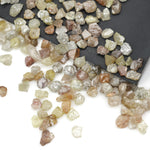 mixed color natural rough diamond pieces with varied raw textures for custom jewelry