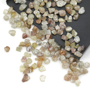 mixed color natural rough diamond pieces with varied raw textures for custom jewelry