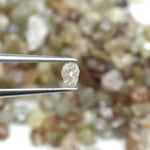 mixed color natural rough diamond pieces with varied raw textures for custom jewelry
