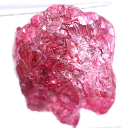 Raw pink diamond on a white background