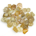 natural fancy yellow rough diamond with raw uncut surface and loose irregular stone