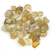 natural fancy yellow rough diamond with raw uncut surface and loose irregular stone