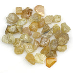 natural fancy yellow rough diamond with raw uncut surface and loose irregular stone